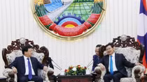 Deputy PM Dung meets Lao Prime Minister, NA Chairwoman