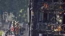 Faced with mounting criticism, British PM visits London fire victims