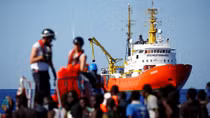 Activists protest as Italy prepares to ship migrants to Spain