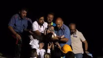 Quake kills two on Italian holiday island, young brothers saved