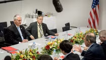 Russian foreign minister meets with Tillerson, denies interfering