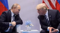 Trump signs Russia sanctions bill, Moscow calls it 'trade war'