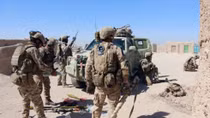 Car bomb kills at least 10 police in besieged Afghan city