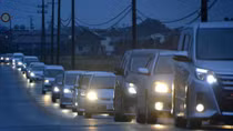 Tsunami hits Japan after strong quake, nuclear plant briefly disrupted
