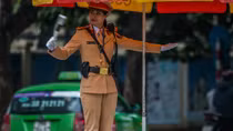 Police officers guide traffic in Hanoi’s extreme cold weather