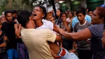 Sixty eight killed in Venezuelan police station riot and fire