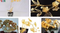 Gold-plated orchid, apricot, and peach tree models attract customers for Tet