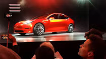 Tesla debuts $35,000 Model 3, sees loss in first quarter
