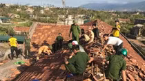 Policemen help people overcome consequences of typhoon Doksuri