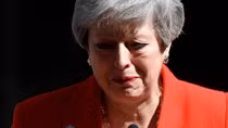 Tearful May resigns, paving way for Brexit confrontation with EU