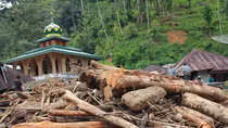 Indonesia flash floods, landslides kill at least 21, destroy hundreds of homes