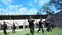 Students of People's Security Academy practice shooting 