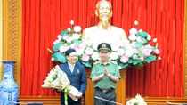 Minister To Lam presents “For National Security” Medal to leader of National Political Publishing House