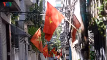 Streets painted red with national flags for National Day