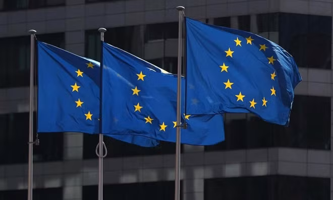 European Union flags fly outside the European Commission headquarters in Brussels, Belgium. Photo by Reuters/Yves Herman.