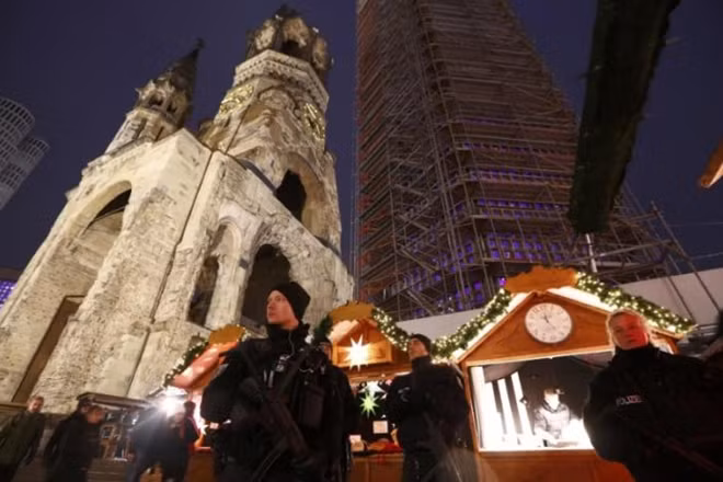 Police patrol at the re-opened Christmas market at Breitscheid square in Berlin, Germany, December 22, 2016, following an attack by a truck which ploughed through a crowd at the market on Monday night. REUTERS/Fabrizio Bensch