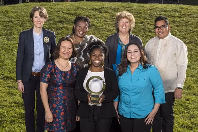 Khanh (left, front row) with other winners of the 2018 Goldman Environmental Prize.