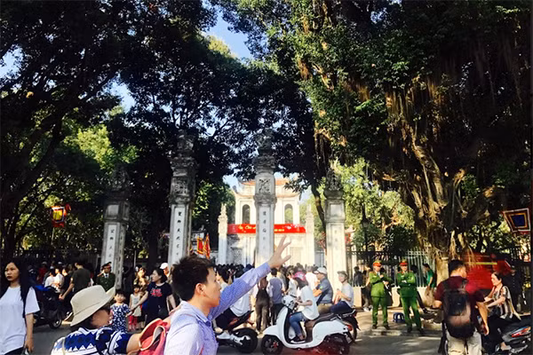 Police officers ensures security and order outside the Van Lake in Temple of Literature.