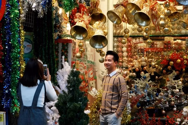 Locals taking photo in Hang Ma street.