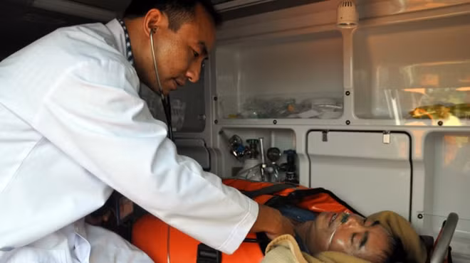Vietnamese doctor conducting health check-up for the Chinese sailor.