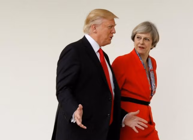 U.S. President Donald Trump escorts British Prime Minister Theresa May after their meeting at the White House in Washington, U.S., January 27, 2017. REUTERS/Kevin Lamarque.