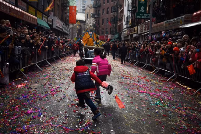 People celebrate the 2017 Lunar New Year - Year of the Rooster in China Town, NY City. Photo: NYT