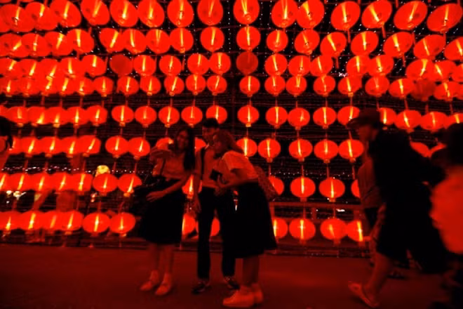 People walk on a street decorated with Chinese lamps to celebrate the Lunar New Year in Bangkok, Thailand January 26, 2017. (Reuters)