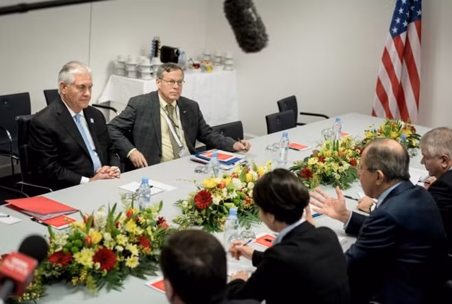 US Secretary of State Rex Tillerson (L) listens to Russian Foreign Minister Sergei Lavrov (2ndR) at the start of a meeting at the World Conference Center in Bonn, Germany February 16, 2017. REUTERS/Brendan Smialowski/POOL.