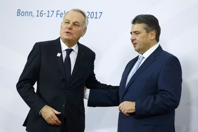 German Foreign Minister Sigmar Gabriel (R) welcomes French Foreign Minister Jean-Marc Ayrault prior to the G-20 Foreign Ministers meeting in Bonn, Germany February 16, 2017. REUTERS/Thilo Schmuelgen.