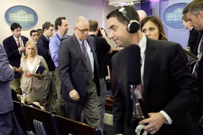 Journalists leave after several major news organizations including CNN, The New York Times and Politico were excluded from an off camera 'gaggle' meeting with White House Press Secretary Sean Spicer in his office that was held in place of the regular daily press briefing at the White House in Washington, U.S., February 24, 2017. REUTERS/Yuri Gripas
