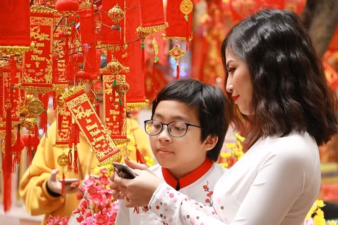 The streets are awash with the richness of red, the colour of Tet, which represents wealth, happiness, and luck.