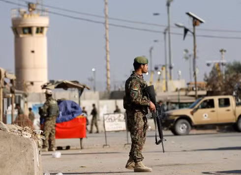 Afghan National Army soldiers keep watch outside the Bagram Airfield entrance gate, after an explosion at the NATO air base. (Photo: Reuters)