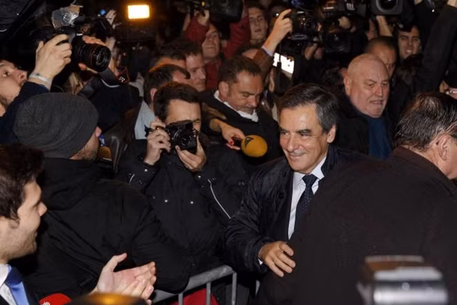 French politician Francois Fillon (R), member of the conservative Les Republicains political party, arrives after partial results in the first round of the French center-right presidential primary election at his headquarters in Paris, France, November 20, 2016.(Photo: Reuters)