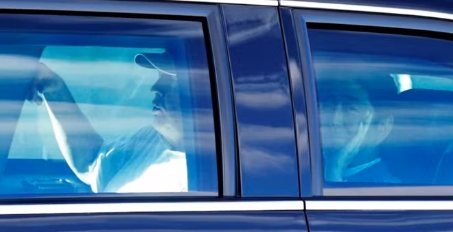 Japanese Prime Minister Shinzo Abe (R) and U.S. President Donald Trump are seen in the Presidential Limousine as they depart from Trump International Golf club in West Palm Beach, Florida, U.S., February 11, 2017, in this photo taken by Kyodo. Mandatory credit Kyodo/via REUTERS
