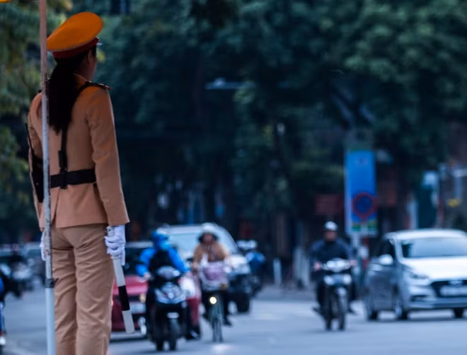Many traffic policewomen working along with their male colleagues on the road to guide traffic.