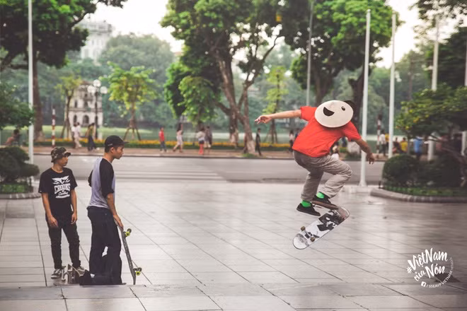 Skateboarding opposite Hanoi's Hoan Kiem Lake.