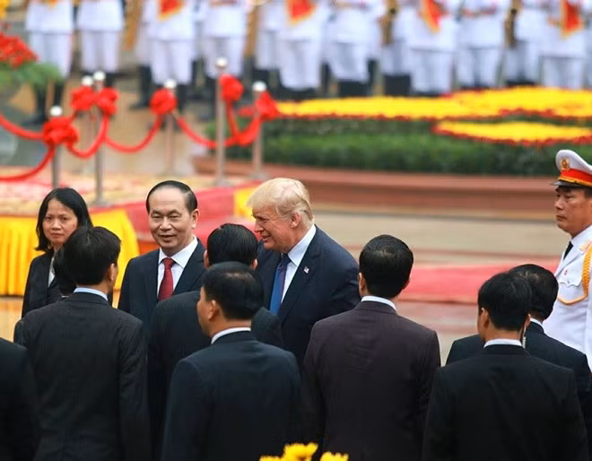 President Donald Trump talking with Vietnamese delegates.