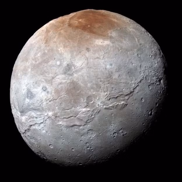 Charon is Pluto's largest moon; the two bodies always show the same fact to one other. Photo: NASA/JHUAPL/SWRI