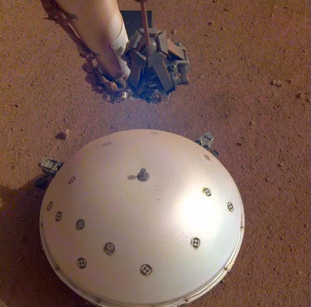 InSight’s seismometer is covered by a domed wind and thermal shield. Photograph: Nasa/EPA