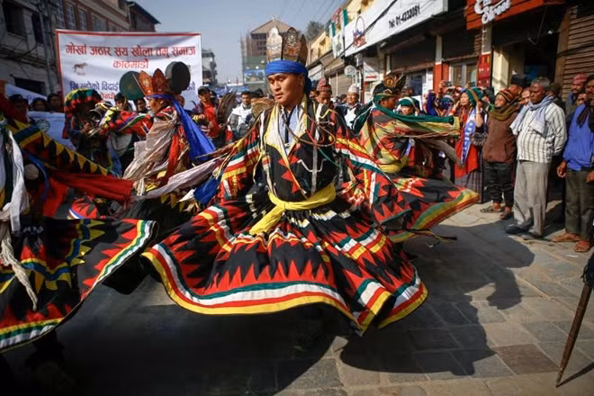 Nepalese men from ethnic Gurung community in traditional attire dance as they take part in parade to mark their New Year also known as Tamu Losar on Dec. 30, in Kathmandu. The indigenous Gurungs, also known as Tamu, are celebrating the advent of the year of the deer.