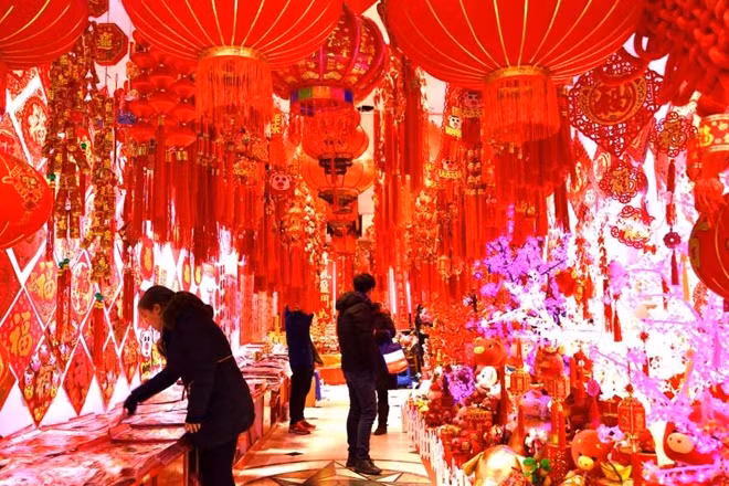 People purchase decorations to welcome the new year at a market on Dec. 29, in Shanghai, China.