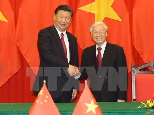 General Secretary of the Communist Party of Vietnam (CPV) Central Committee Nguyen Phu Trong (R) and General Secretary of the Communist Party of China (CPC) Central Committee and State President Xi Jinping