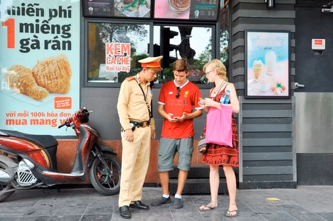 Hanoi Traffic police officers are helping foreign tourists to find their way.