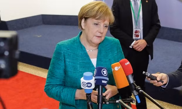 German chancellor Angela Merkel speaks to the press before leaving the first day of a European Union leaders’ summit focused on migration, Brexit and eurozone reforms. Photograph: Aris Oikonomou/Getty Images German chancellor Angela Merkel speaks to the press before leaving the first day of a European Union leaders’ summit focused on migration, Brexit and eurozone reforms. Photograph: Aris Oikonomou/Getty Images