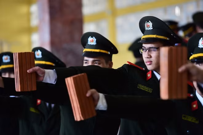 Before real shooting, students practice holding brick. This will help student get used to holding a heavy object while stabilizing the line of sight.