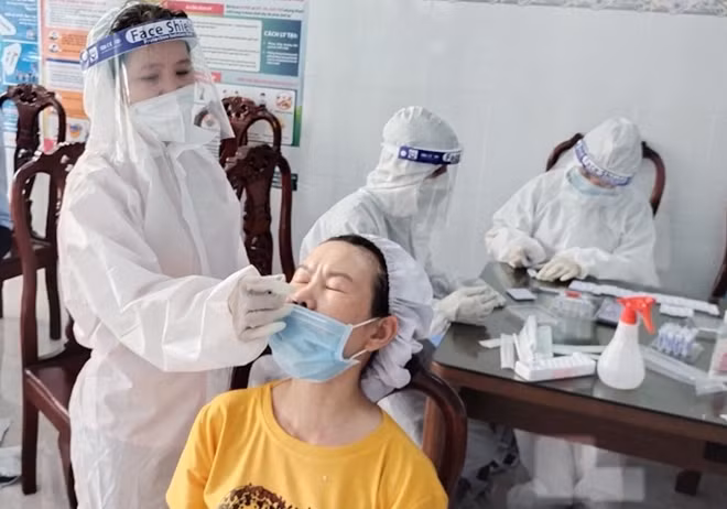 Taking nasal swabs for COVID-19 testing in Vietnam. Taking nasal swabs for COVID-19 testing in Vietnam.
