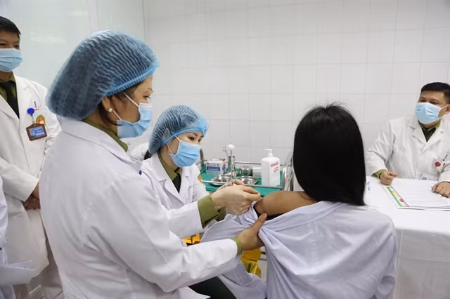 A volunteer is given a shot of the 75mcg dose of Nanocovax on January 12. Photo: VNA.