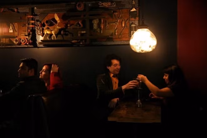 Zander Dejah, 25, a Virtual Reality engineer and Isha Padhye, 23, a UI designer toast as they socialise at a bar in San Francisco, California, U.S. February 12, 2017. REUTERS/Gabrielle Lurie