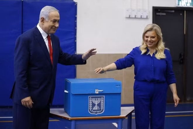 Israel’s Prime Minister Benjamin Netanyahu casts his vote with his wife Sara during Israel's parliamentary election in Jerusalem April 9, 2019. Ariel Schalit/Pool via REUTERS