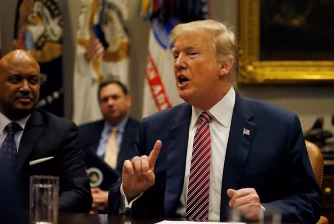 U.S. President Donald Trump talks about gun safety in schools during a meeting with local and state officials about improving school safety at the White House in Washington, U.S., February 22, 2018. REUTERS/Leah Millis
